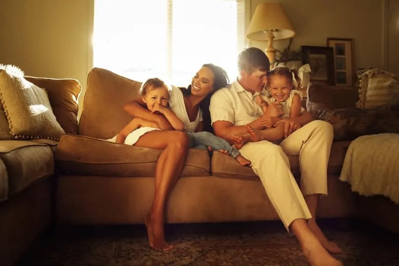 Lucas Twenge and his family on the couch at home